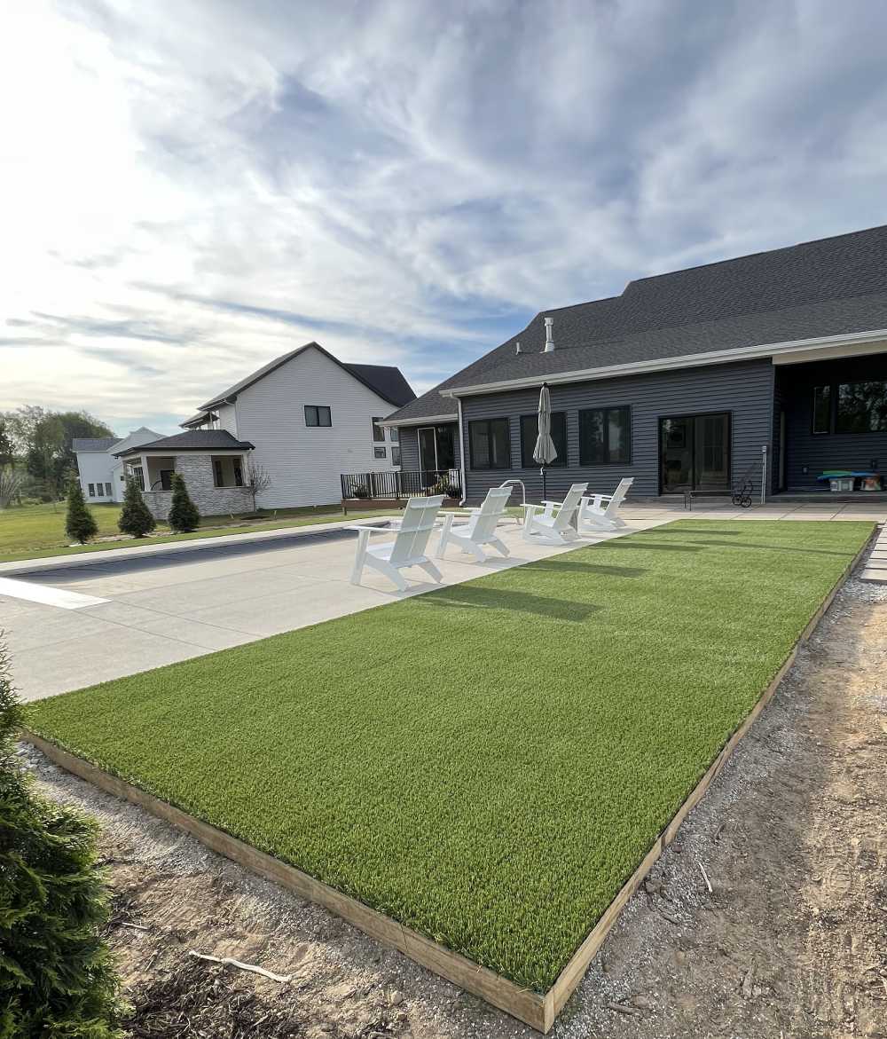 Artificial grass backyard lounge area from SYNLawn