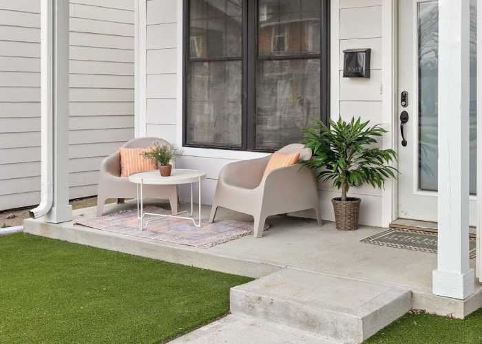 Front patio with artificial grass yard