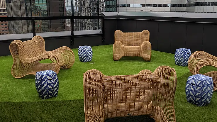 Artificial grass rooftop lounge area from SYNLawn