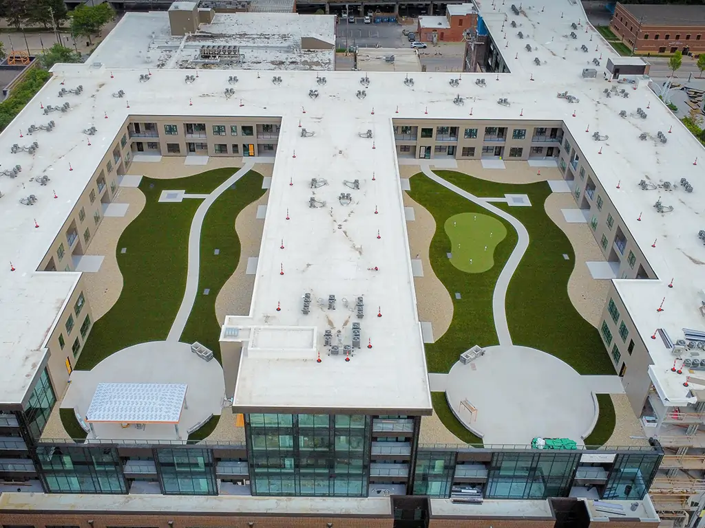 Drone shot of commercial artificial grass rooftop