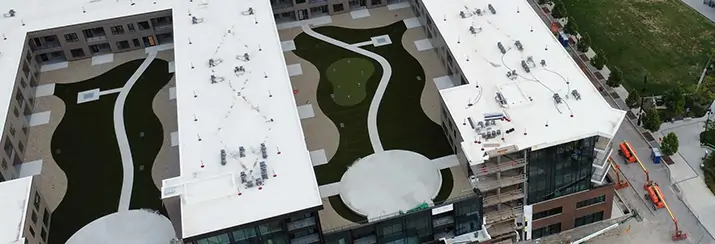 Rooftop putting green at riverfront promenade from SYNLawn